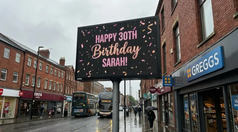 Happy 30th birthday message on a high street billboard